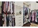 Well-organized walk-in closet featuring built-in shelving, drawers, and hanging rods for ample storage at 15415 Mulholland Rd, Parrish, FL 34219