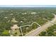 Breathtaking aerial view of the property, showcasing its expansive land, serene surroundings, and prime location at 16608 Livingston Ave, Lutz, FL 33559