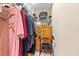 Walk-in closet featuring shelving, rods for hanging clothes, and a storage cabinet at 16608 Livingston Ave, Lutz, FL 33559