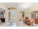 Elegant dining room featuring double doors to the backyard and classic china cabinet at 16608 Livingston Ave, Lutz, FL 33559