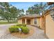 Well-maintained property with lush landscaping and an inviting entrance, enhancing the home's appeal at 16608 Livingston Ave, Lutz, FL 33559