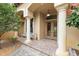 Inviting front porch with classic columns, double doors, and well-maintained landscaping at 16608 Livingston Ave, Lutz, FL 33559