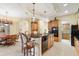 Kitchen island with pendant lights and seating and adjacent breakfast nook at 16608 Livingston Ave, Lutz, FL 33559