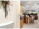 Open kitchen with bar seating, pendant lighting, and access to additional living spaces at 16608 Livingston Ave, Lutz, FL 33559