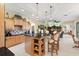 Spacious kitchen featuring an island with seating and tiled floors at 16608 Livingston Ave, Lutz, FL 33559