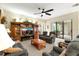 Inviting living area with an entertainment center and access to the screened lanai at 16608 Livingston Ave, Lutz, FL 33559