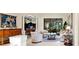 Open concept living area featuring elegant furnishings, an adjacent dining space, and natural light at 16608 Livingston Ave, Lutz, FL 33559