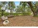 Inviting park area with park benches, mature trees, and a tranquil setting, perfect for enjoying nature's beauty at 16608 Livingston Ave, Lutz, FL 33559