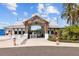 Entrance to Southshore Bay featuring a wooden archway and well-manicured landscaping at 17005 Avon Dive Ln, Wimauma, FL 33598
