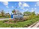 Southshore Bay community sign surrounded by lush greenery and colorful flowers at 17005 Avon Dive Ln, Wimauma, FL 33598