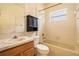 Well-lit bathroom with vanity, storage cabinet, and shower-tub combination at 17910 Timber View St, Tampa, FL 33647