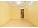Bedroom offering natural light, tile flooring, and arched closet entrance at 17910 Timber View St, Tampa, FL 33647