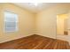 Bedroom featuring hardwood floors and a window for natural light at 17910 Timber View St, Tampa, FL 33647