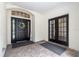 Welcoming front porch with decorative wreath, double doors and brick flooring at 17910 Timber View St, Tampa, FL 33647