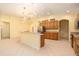 Well-lit kitchen with stainless appliances, tile floors, ample counter space and generous pantry at 17910 Timber View St, Tampa, FL 33647