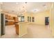 Bright kitchen featuring tiled floors, modern lighting and stainless appliances at 17910 Timber View St, Tampa, FL 33647