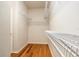A walk-in closet featuring wood floors and wire shelving at 17910 Timber View St, Tampa, FL 33647
