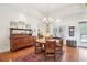 Dining room featuring hardwood floors, chandelier, and sideboard at 1803 143Rd E Ct, Bradenton, FL 34212