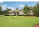 Charming single story home with stone details, beautiful landscaping, and a well-maintained lawn at 1803 143Rd E Ct, Bradenton, FL 34212