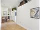 Well-lit hallway featuring tiled floors and decorative accents at 1803 143Rd E Ct, Bradenton, FL 34212