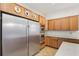 Kitchen featuring stainless steel appliances, custom cabinets, and stylish design elements at 1803 143Rd E Ct, Bradenton, FL 34212
