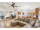 Spacious living room open to the kitchen with stainless steel appliances and kitchen island at 1803 143Rd E Ct, Bradenton, FL 34212