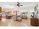 Living area featuring tile flooring and open access to the kitchen with stainless steel appliances at 1803 143Rd E Ct, Bradenton, FL 34212