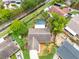 An aerial view showcases the layout of the property, including the pool at 1909 Dover Ct, Oldsmar, FL 34677