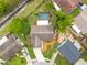 An aerial view highlights the property and backyard, including a pool at 1909 Dover Ct, Oldsmar, FL 34677