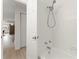 Bathroom boasting white subway tile in shower and access to the rest of the home at 1909 Dover Ct, Oldsmar, FL 34677