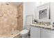 Bathroom features a walk-in shower with tile and granite vanity at 1909 Dover Ct, Oldsmar, FL 34677