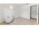 Modern bedroom featuring wood-look floors, stylish light fixture, and comfortable seating at 1909 Dover Ct, Oldsmar, FL 34677