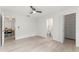 Open bedroom featuring a closet with shelving and bathroom access at 1909 Dover Ct, Oldsmar, FL 34677