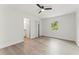 Spacious bedroom with a modern ceiling fan and access to a bathroom at 1909 Dover Ct, Oldsmar, FL 34677