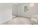 Sun-filled bedroom with wood-look flooring, mirrored closet, and modern lighting at 1909 Dover Ct, Oldsmar, FL 34677