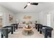 Well-lit living room featuring modern furniture, neutral decor, and hardwood floors, creating a serene and stylish atmosphere at 1909 Dover Ct, Oldsmar, FL 34677