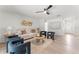 Bright living room with modern decor, contemporary furniture, neutral paint, and light hardwood floors, creating a stylish and inviting space at 1909 Dover Ct, Oldsmar, FL 34677