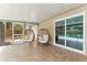 Outdoor patio with stylish egg chairs offering a view of the backyard and pool at 1909 Dover Ct, Oldsmar, FL 34677