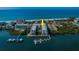 Waterfront condo with private docks and boat slips and lush landscaping, steps away from the beach, offering a serene coastal living at 19531 Gulf Blvd # 306, Indian Shores, FL 33785