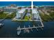 Waterfront condo buildings with a pool, boat docks, and water views at 19531 Gulf Blvd # 306, Indian Shores, FL 33785
