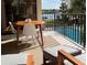 Outdoor dining set on a private balcony overlooking the swimming pool and intercoastal waters at 19531 Gulf Blvd # 306, Indian Shores, FL 33785