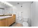 Bright bathroom with a modern vanity, fresh towels, and standard toilet for a clean, functional space at 19531 Gulf Blvd # 306, Indian Shores, FL 33785