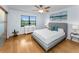 Bright bedroom with modern furniture, hardwood floors, and large windows showcasing stunning views at 19531 Gulf Blvd # 306, Indian Shores, FL 33785
