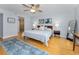 Bright, airy bedroom featuring hardwood floors, large windows, and closet space at 19531 Gulf Blvd # 306, Indian Shores, FL 33785