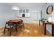 Bright dining area with hardwood floors, perfect for entertaining friends and Gathering in style at 19531 Gulf Blvd # 306, Indian Shores, FL 33785