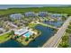 An aerial view of a community pool, clubhouse, condos and lakes with highway access at 2333 Feather Sound Dr # A107, Clearwater, FL 33762