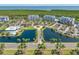 An aerial view of a community with a pool, clubhouse, lakes and highways at 2333 Feather Sound Dr # A107, Clearwater, FL 33762