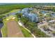 An aerial view of the condo community, showcasing the golf course and lush surroundings at 2333 Feather Sound Dr # A107, Clearwater, FL 33762