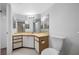 Bathroom includes vanity, mirror and tile flooring next to toilet at 2333 Feather Sound Dr # A107, Clearwater, FL 33762