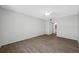 Bright bedroom features wood-look flooring and a ceiling fan at 2333 Feather Sound Dr # A107, Clearwater, FL 33762